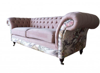 A lively three-seater Chesterfield sofa with a delicate pink floral pattern